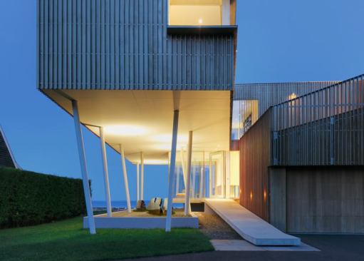Joeb Moore + Partners Architects' highly conceptual Spiral House was conceived as an extension of the shoreline site's natural and social contexts. Vertical Western red cedar battens reinterpret the coastal Connecticut vernacular of shingle-style board-and-batten siding.