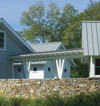 “We did a stone shelf on the foundation so it looks like complete stone foundation all the way down,” architect Peter Twombly explains. “In reality, the foundation is concrete with a recess that accepts the stone veneer work.”