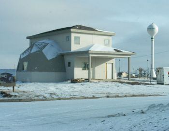 This split-geodesic-dome dwelling is one of more than 100 homes rebuilt by residents to be super energy efficient.