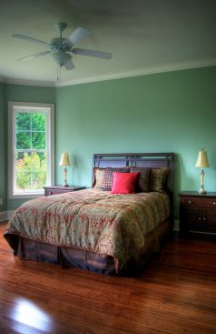 The downstairs master suite features his-and-her walk-in closets and a bathroom with low-flow bath fixtures and a Kohler dual-flush toilet.