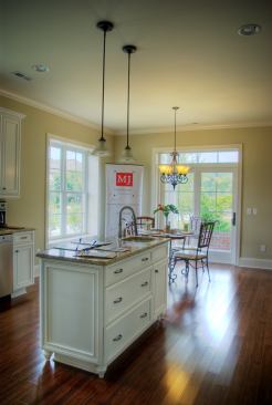 The kitchen features granite countertops, an extended center island, and built-in Energy Star appliances.