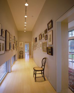 Circulation spaces are often spaces to hang mementos and treasured objects--this house has a hallway like that, too.
