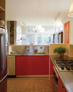The short hallway that serves as a library and office is tucked behind the home's open kitchen.
