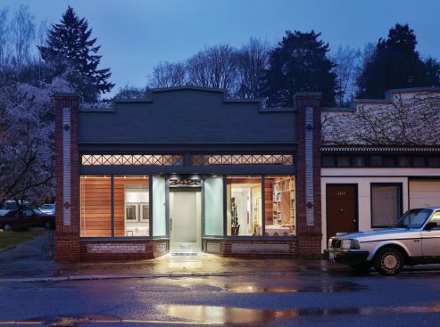 The house, a former storefront, contains an ipe-clad core containing the kitchen and a powder room that separates the front and back of the house.