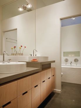 The master bedroom and bath borrows light from the interior courtyard through a clerestory.