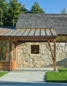A low-pitched copper roof shelters the main entry.