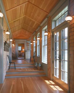 A sun-filled corridor brings light into the first-floor rooms and is a source of passive solar warmth.