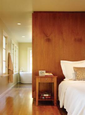 Natural materials including mahogany for the casework, marble for the countertops, and stone tilework complement the rest of the houses rich palette.