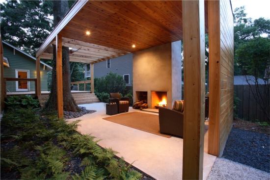 The concrete of the floor slab rises into a freestanding chimney.