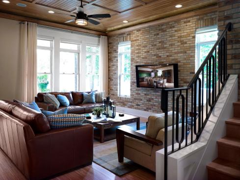 The family room features an exposed brick wall but no fireplace, Alvarez says, because conventional units can be extremely inefficient and drafty.

