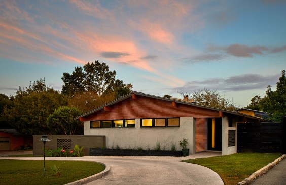 Cypress slats are used throughout the project fusing together the spaces. From the circular driveway to the kitchen and living spaces, the slats guide you into the home in an effort to maintain it's mid century charm. 