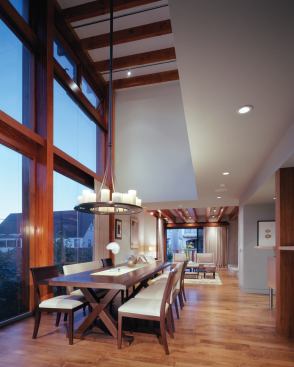 A band of windows along the kitchen wall ameliorates the glare from the sunlight streaming in through doubleheight western windows.