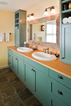 Trim elements made from raw wood are found throughout the house, such as the mirror frame in the master bath.