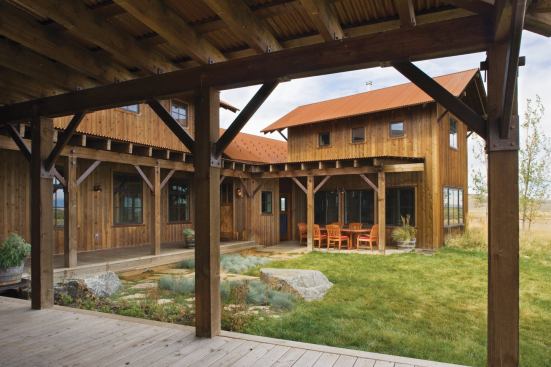 The house wraps around an east-facing courtyard to provide an outdoor space that’s protected from prevailing western winds.