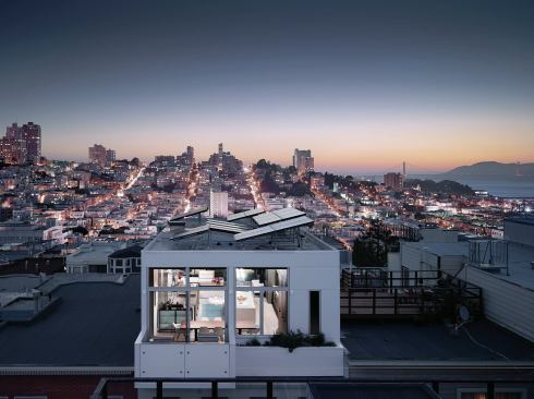 The house is fitted with 3.7-kWh PV panels over a cool roof. Daylighting controls on the top floor (fixed and motorized, internal and external) negate the need for artificial lighting while controlling solar heat gain