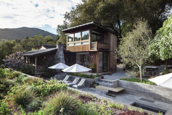 The renovation of an existing cottage included a 630-square-foot addition—family room down, master suite above--a detached garage with a planted roof (visible in foreground), and updated outdoor spaces.