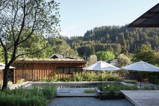 The new garage, with board-and-batten siding, was designed to look like a pool house.