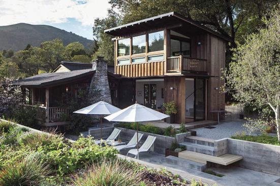 The renovation of an existing cottage included a 630-square-foot addition—family room down, master suite above--a detached garage with a planted roof (visible in foreground), and updated outdoor spaces.