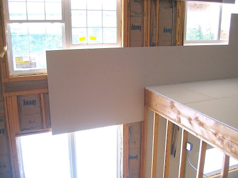 Note how the gypsum panel spans over the load pathways.
