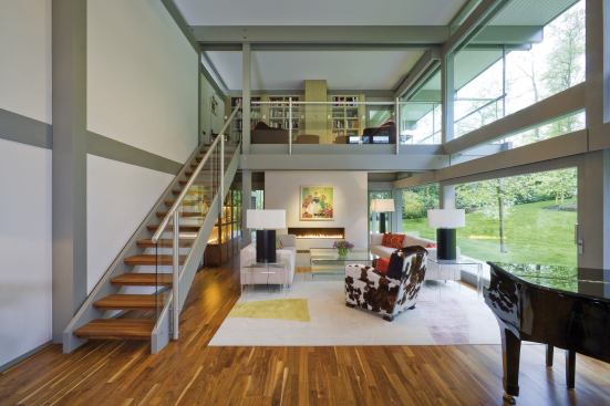 A great room inside a flat-roof Huf Haus.