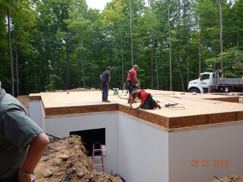 Flooring is added above the foundation.