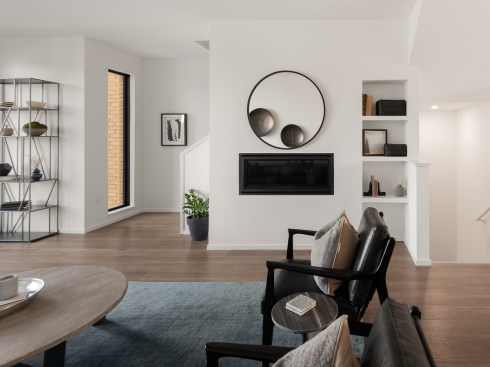 On the townhomes’ second levels, the design team installed 42-inch, linear gas fireplaces with modern glass openings.