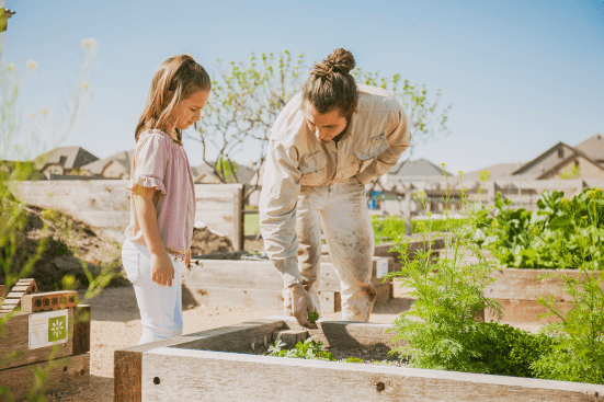The working farmer grows crops on the Harvest community's 5-acre farm and teaches gardening classes to residents.