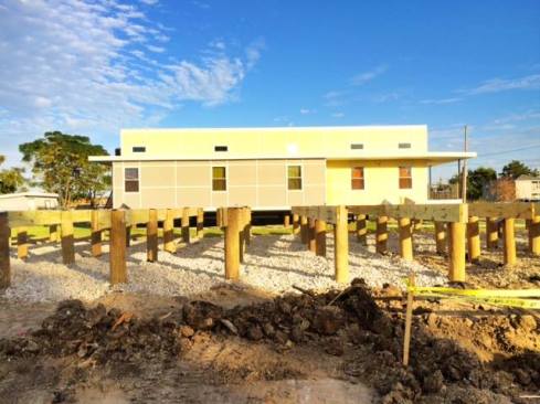 The site was prepared for delivery of the 1,450-square-foot home.