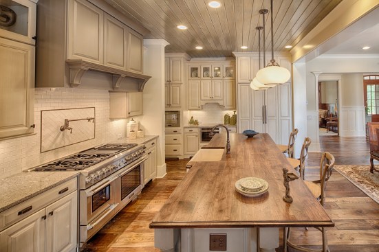 This kitchen incorporates natural tones into the traditional color scheme. Project: Georgetown by Visbeen Architects, Inc. 