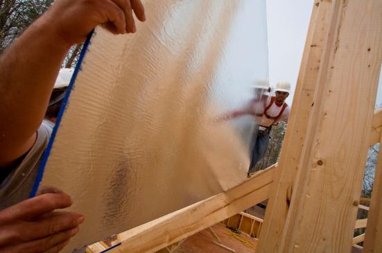 Radiant Barrier  
A radiant barrier is simple: It's just a structural panel with a reflective material (usually aluminum) laminated to one side that installs foil side down on a roof deck to reduce heat gain in warm climates. Manufacturers say the panels can block up to 97% of heat transfer through roof sheathing, which lowers attic temperatures and consequently reduces cooling costs by 5% to 10%. Studies say the material ranges from 15 cents to 75 cents per square foot, but you have to install roof sheathing anyway, so why not get one with the foil attached?