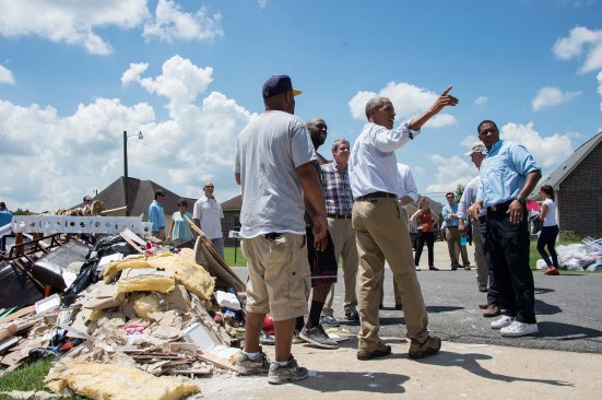 President Barack Obama spoke with residents in August as he toured a flood-affected area in Baton Rouge.