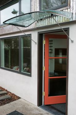 A windshield awning gives a whimsical nod to the owner’s passion for classic cars.
