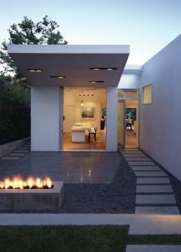 This remodel organizes the house around a pathway that angles through the 50-foot-wide lot