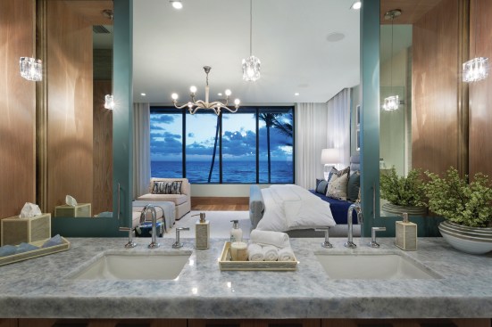 Sliding barn doors between this bath and bedroom give homeowners the option to open up the space as a suite or compartmentalize the rooms when needed.