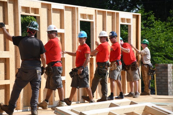 Wells Fargo employees and volunteers raising a wall for a new home in Charlotte, North Carolina.
