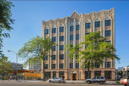 The 1930 Art Deco former hotel is on the National Register of Historic Places and is located near retail, a public park, and transit. To the left is the butterfly-roof multi-purpose pavilion.