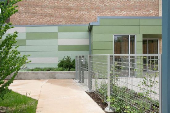 A fiber-cement-clad addition relates to the garden