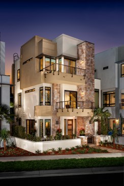 Stone accents add texture and color to the stucco homes.