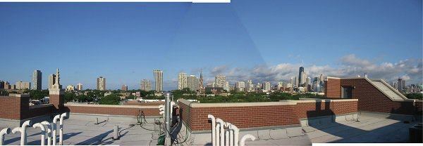 The existing parapet wall provides some wind protection.