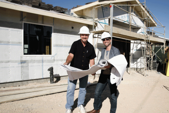 HomeAid
Southern Nevada President Rocky Cochran and Arash Ghafoori, executive director
of the Nevada
Partnership for Homeless Youth, confer over plans for an expansion of a teen drop-in Center in Las Vegas. The project, completed earlier this year, was led by a team from Pardee Homes. 