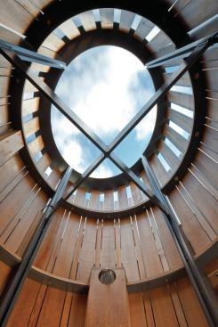 Once the steel frame had been lowered onto the porch, the team rotated it until the structural crossbars were in perfect alignment with the orthogonal points of a compass. 
