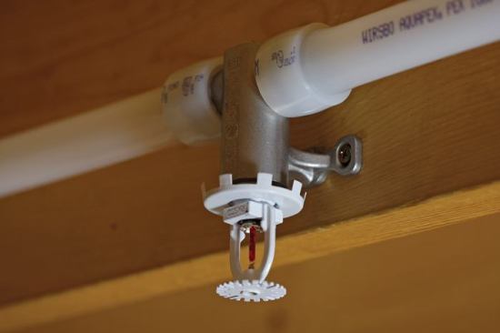 Uponor. Unlike competitive stand-alone sprinkler systems, the Aquasafe Looped Residential Fire Safety System integrates into a home’s cold water plumbing. This means that water circulates each time cold water is used and does not remain stagnant. “As long as you have water supplied to your plumbing fixtures, you know you have water supplied to your sprinklers,” explains Jayson Drake, senior product manager of fire safety and Uponor. Recently redesigned, the product uses fewer feet of polyethylene tubing and fewer connections than before, making it easier to design and install. 
www.uponor-usa.com. 
–Victoria Markovitz