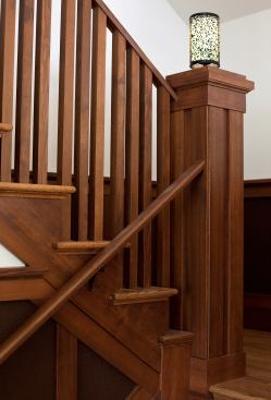 A dark wood railing provides a Craftsman-inspired touch.