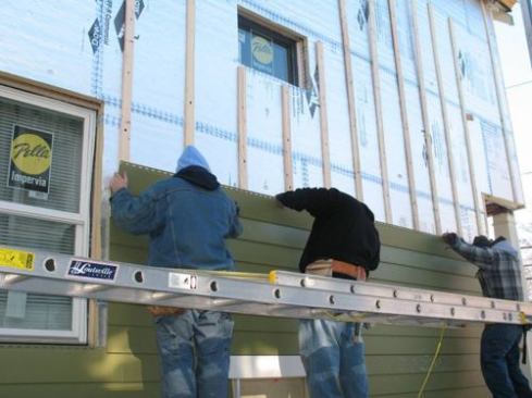 Contractors installed NuCedar cellular PVC siding over the furring strips.