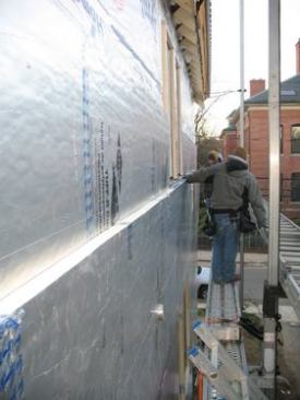 Walls were given two layers of 2-inch polyisocyanurate rigid foam board.