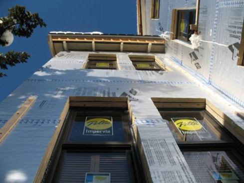 The thickness of the foam boards can be seen around the new windows.
