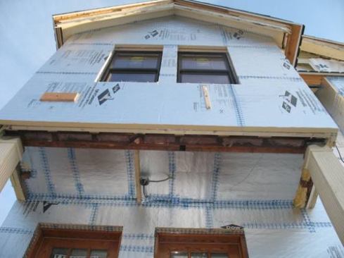 Even the underside of the house gets foam board in order to wrap the entire house in a protective skin.