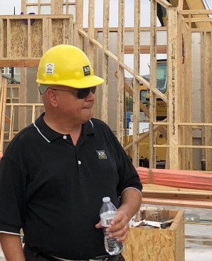 Jacob Atalla, vp for sustainability at KB Home, works as team member participant and observer on vertical assembly process for KB Home ProjeKt.