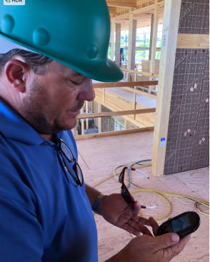 Chowa--one of American home building's first tri-lingual jobsites--avails of 'Jennifer' for translation, Japanese to Spanish to English.