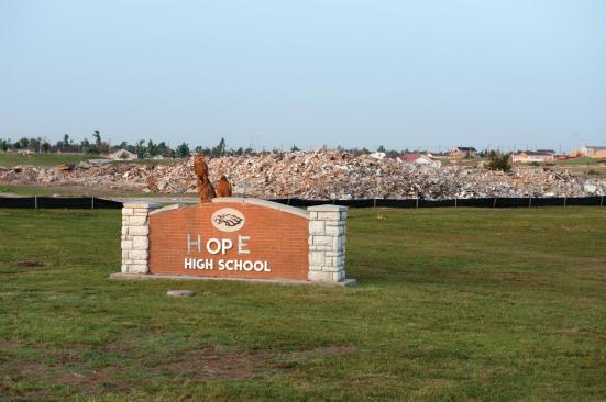 The old sign for Joplin High School bears a new message.